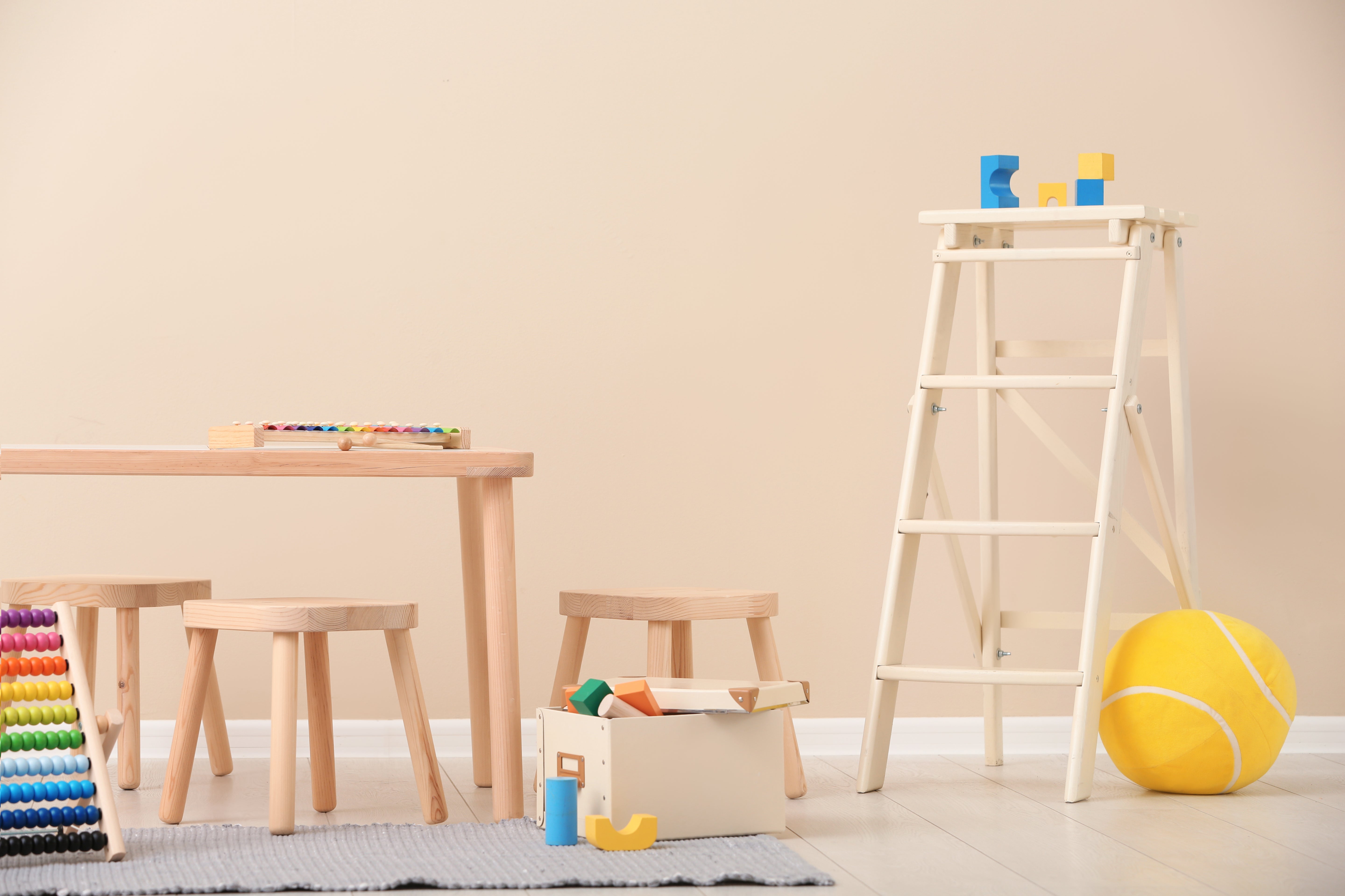Stylish child's room interior with toys and furniture, featuring modern decor and a cozy, playful atmosphere.